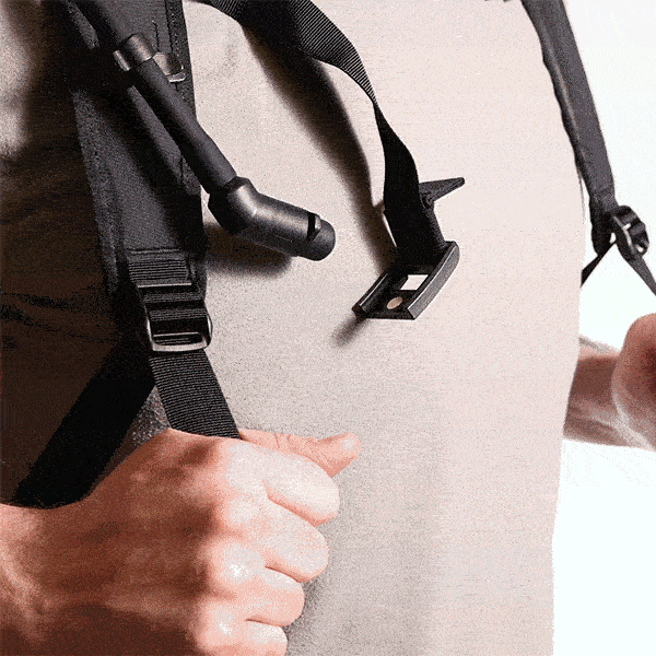 Person adjusting hydration pack on their body