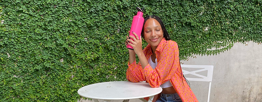 Women holding a ReHydration Bottle