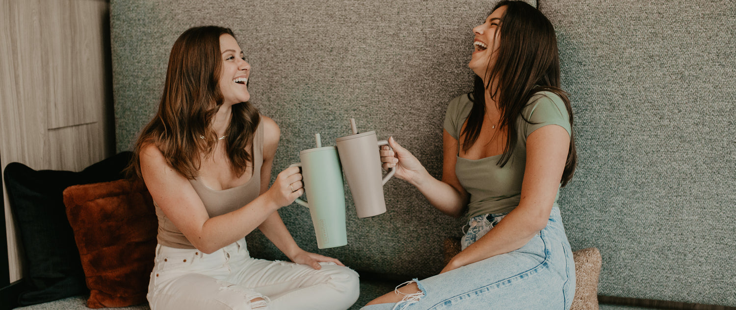 Two women holding BruMate Eras.