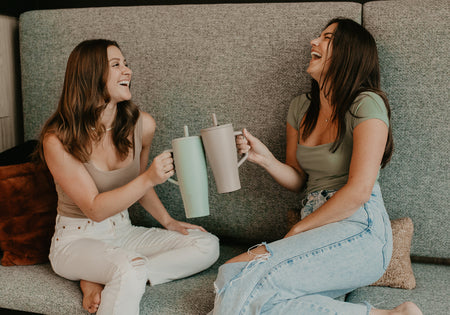 Two women holding BruMate Eras.