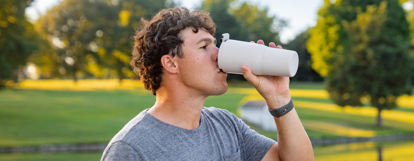 Women holding a ReHydration Bottle
