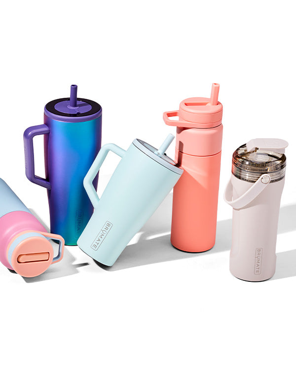 Water bottle and tumblers leaning on each other