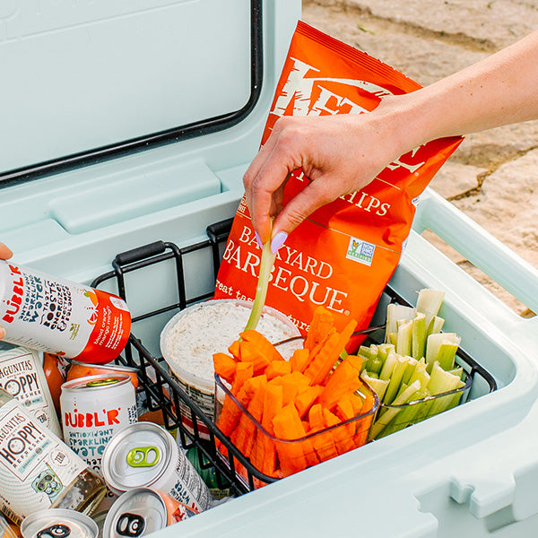 Woman using the dry rack in the BruTank 55qt