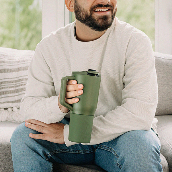 A person with a OD Green Müv 35oz