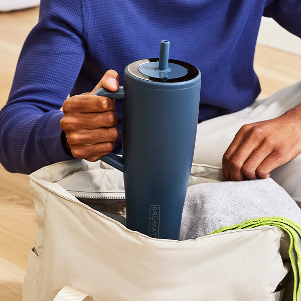 Man putting Era into his workout bag
